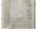 Close up of the spacious shower with tile surround and seating at 2235 Chestnut Pass, Decatur, GA 30033