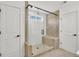 Modern bathroom with glass shower enclosure, neutral tile, and sleek design at 307 Rockledge Sw Bnd, Powder Springs, GA 30127