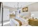 A relaxing bedroom features neutral tones, a chandelier, and natural light from the window at 307 Rockledge Sw Bnd, Powder Springs, GA 30127