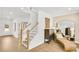 Bright foyer featuring hardwood floors, staircase, and elegant decor at 307 Rockledge Sw Bnd, Powder Springs, GA 30127