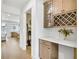 Hallway features a built-in cabinet with wine rack, counter space, and hardwood flooring at 307 Rockledge Sw Bnd, Powder Springs, GA 30127