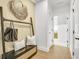 Entryway features a bench with storage, wall decor, and access to other rooms at 307 Rockledge Sw Bnd, Powder Springs, GA 30127