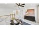 Open loft area featuring neutral decor, modern fan, and views to the outside at 307 Rockledge Sw Bnd, Powder Springs, GA 30127