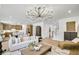 Spacious living room with elegant decor, open layout, and comfortable seating at 307 Rockledge Sw Bnd, Powder Springs, GA 30127