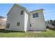 View of the exterior back of the home with a well-maintained backyard at 3459 Village Park Sw Ln, Atlanta, GA 30331