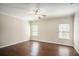 Spacious bedroom with hardwood flooring, a ceiling fan, and plenty of natural light at 3459 Village Park Sw Ln, Atlanta, GA 30331