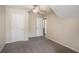 Bright bedroom featuring neutral walls, a ceiling fan, and two doors to other rooms at 3459 Village Park Sw Ln, Atlanta, GA 30331