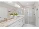 Bathroom featuring a double vanity, sleek shower with glass doors, and modern finishes at 938 Catamaran Ct, Alpharetta, GA 30005