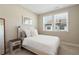 A cozy bedroom with large window and comfortable carpeting at 938 Catamaran Ct, Alpharetta, GA 30005