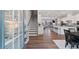 Bright foyer with hardwood floors, showcasing an open floor plan with staircase, kitchen and living area at 938 Catamaran Ct, Alpharetta, GA 30005