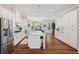 Spacious kitchen featuring a large island, stainless steel appliances, and hardwood flooring at 938 Catamaran Ct, Alpharetta, GA 30005