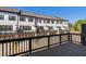 Townhome rear view from a balcony, showing patios, garages, and landscaping at 938 Catamaran Ct, Alpharetta, GA 30005