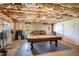 Large basement area with a billiards table provides ample space for recreation at 1950 Lancaster Se Dr, Conyers, GA 30013