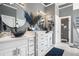 Stylish primary bath with dual sinks, modern fixtures, and great lighting at 1950 Lancaster Se Dr, Conyers, GA 30013