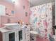 Adorable bathroom with themed shower curtain and vanity at 1950 Lancaster Se Dr, Conyers, GA 30013