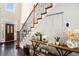 Home foyer with wood floors, staircase and decorative furnishings at 1950 Lancaster Se Dr, Conyers, GA 30013