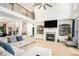 Bright and airy living room boasts high ceilings, fireplace, and built-in shelving at 1950 Lancaster Se Dr, Conyers, GA 30013