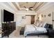Relaxing main bedroom features a tray ceiling, barn door, and plush furnishings at 1950 Lancaster Se Dr, Conyers, GA 30013