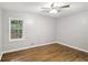 Bedroom with hardwood floors, a ceiling fan, and a window at 2804 Dearwood Sw Dr, Atlanta, GA 30315