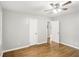 Bedroom with hardwood floors, a ceiling fan, and two doors at 2804 Dearwood Sw Dr, Atlanta, GA 30315