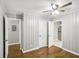 Bedroom with hardwood floors, ceiling fan, and doors leading to other rooms at 2804 Dearwood Sw Dr, Atlanta, GA 30315