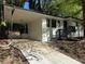 Charming single-story white home with a black trim, car port, and a front porch with black railings at 2804 Dearwood Sw Dr, Atlanta, GA 30315