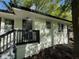Charming single-story white home with a black trim and a front porch with black railings at 2804 Dearwood Sw Dr, Atlanta, GA 30315