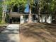Charming single-story white home with a black trim, car port, and a front porch with black railings at 2804 Dearwood Sw Dr, Atlanta, GA 30315