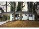 Charming single-story white home with a black trim, car port, and a front porch with black railings at 2804 Dearwood Sw Dr, Atlanta, GA 30315