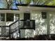 Charming single-story white home with a black trim and a front porch with black railings at 2804 Dearwood Sw Dr, Atlanta, GA 30315