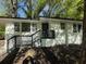 Charming single-story white home with a black trim and a front porch with black railings at 2804 Dearwood Sw Dr, Atlanta, GA 30315