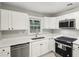 Clean kitchen with white cabinets, stainless steel appliances, and marbled floors at 2804 Dearwood Sw Dr, Atlanta, GA 30315