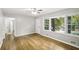 Light-filled living room boasts original hardwood floors, neutral walls, and entry to other rooms at 2804 Dearwood Sw Dr, Atlanta, GA 30315