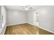Bright living room features gleaming hardwood floors, neutral walls, and seamless kitchen access at 2804 Dearwood Sw Dr, Atlanta, GA 30315