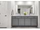 Bathroom featuring double sink vanity with modern fixtures and a large mirror at 309 Vista Ln, Woodstock, GA 30189