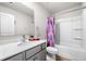 Bathroom with tub, shower, single sink vanity and cabinet at 309 Vista Ln, Woodstock, GA 30189