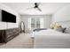 Bedroom features a dresser, ceiling fan, carpet, and natural light from the window at 309 Vista Ln, Woodstock, GA 30189