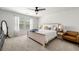 Bright bedroom with neutral colors, a ceiling fan, and a well-lit reading nook at 309 Vista Ln, Woodstock, GA 30189