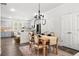 Open-concept kitchen and dining area with stylish furnishings and modern finishes at 309 Vista Ln, Woodstock, GA 30189