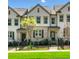 Charming townhome with well-maintained lawn, neutral siding, and a wrought iron fence at 309 Vista Ln, Woodstock, GA 30189