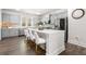 Bright kitchen with gray cabinets, a large island with seating, and stainless steel appliances at 309 Vista Ln, Woodstock, GA 30189