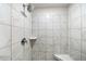 Tiled shower with bench and shower head at 309 Vista Ln, Woodstock, GA 30189