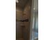 Modern bathroom with tiled shower featuring built in shelf and a soaking tub next to a window at 5007 Fairview Cir, Villa Rica, GA 30180