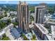Stunning aerial view of high-rise condo with pool and parking area at 3481 Lakeside Ne Dr # 907, Atlanta, GA 30326