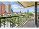 Spacious balcony with city views and wrought iron railing at 3481 Lakeside Ne Dr # 907, Atlanta, GA 30326