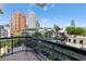 Balcony view showcasing the cityscape with high-rise buildings and lush trees at 3481 Lakeside Ne Dr # 907, Atlanta, GA 30326