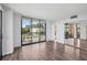 Bedroom with sliding glass doors, mirrored closet doors, and neutral decor at 3481 Lakeside Ne Dr # 907, Atlanta, GA 30326