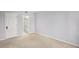 A vacant bedroom featuring neutral walls, carpeted floors, and a door leading to a bathroom at 3481 Lakeside Ne Dr # 907, Atlanta, GA 30326