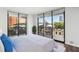 Bright bedroom featuring large windows with city views, flooding the room with natural light at 3481 Lakeside Ne Dr # 907, Atlanta, GA 30326