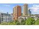 Exterior view featuring modern residential towers with lush greenery in the foreground at 3481 Lakeside Ne Dr # 907, Atlanta, GA 30326
